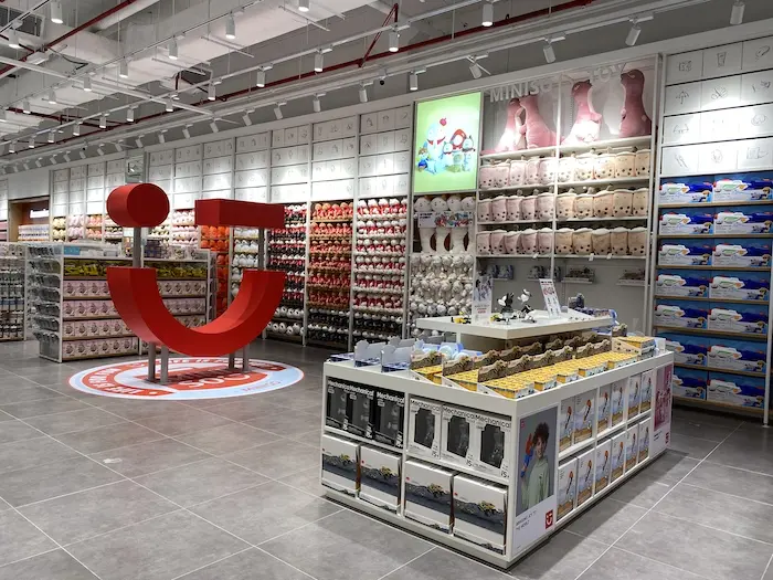 Modern toy store interior with colorful shelves and displays.